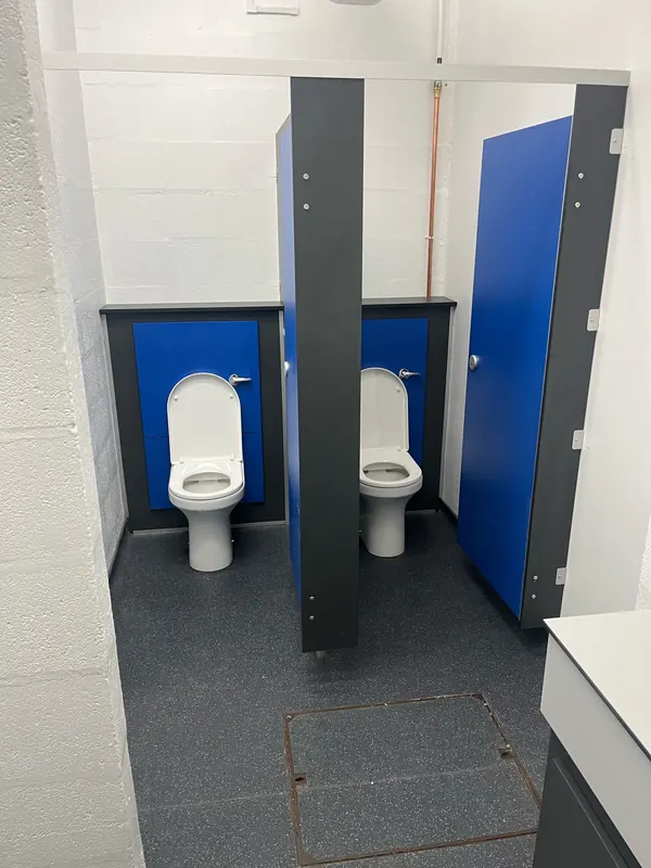 Washroom refit: WC cubicles with duct panels and new pans